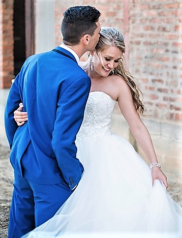 groom in blue suit wedding