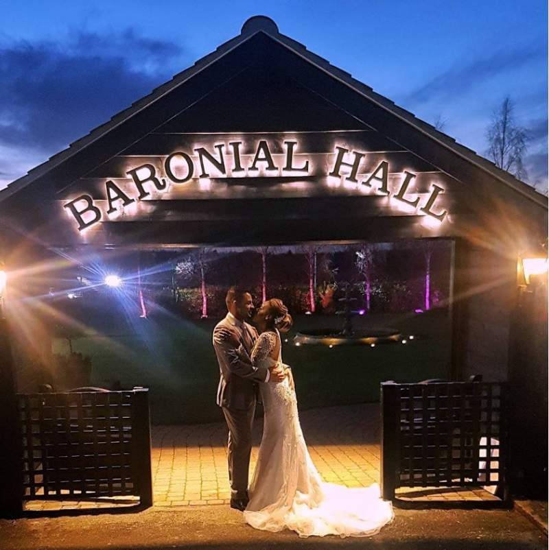 bride and groom outside the barional hall at crondon park in essex