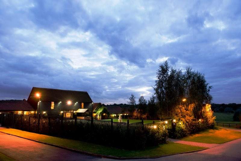 crondon park wedding venue in essex at night baronial hall